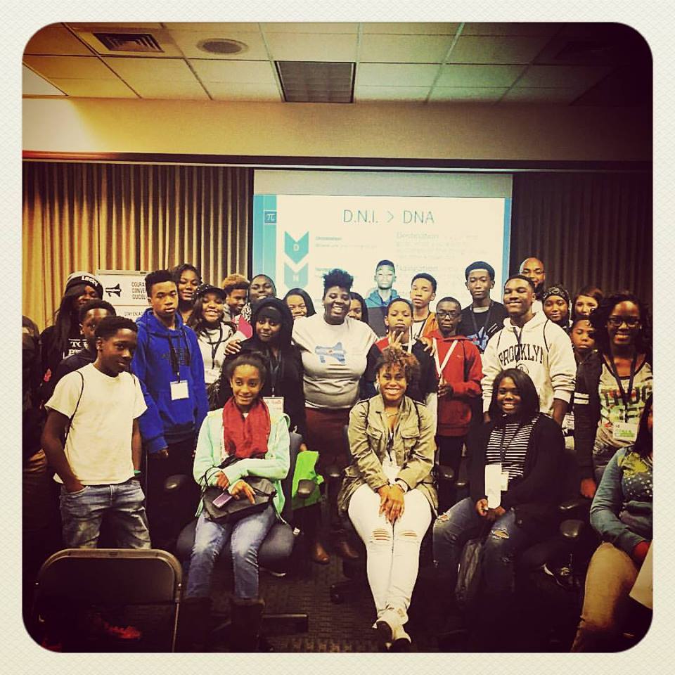 Carlton, hidden in the back right, with students at the YCC Youth Conference where he was a facilitator.